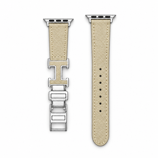 Cream leather Her Apple Watch band with silver H-shaped clasp, flat view