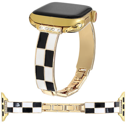 Black and white checkerboard band with warm metal finish and Apple Watch
