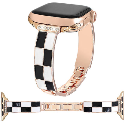 Black and white checkerboard band with rose gold-tone metal and Apple Watch
