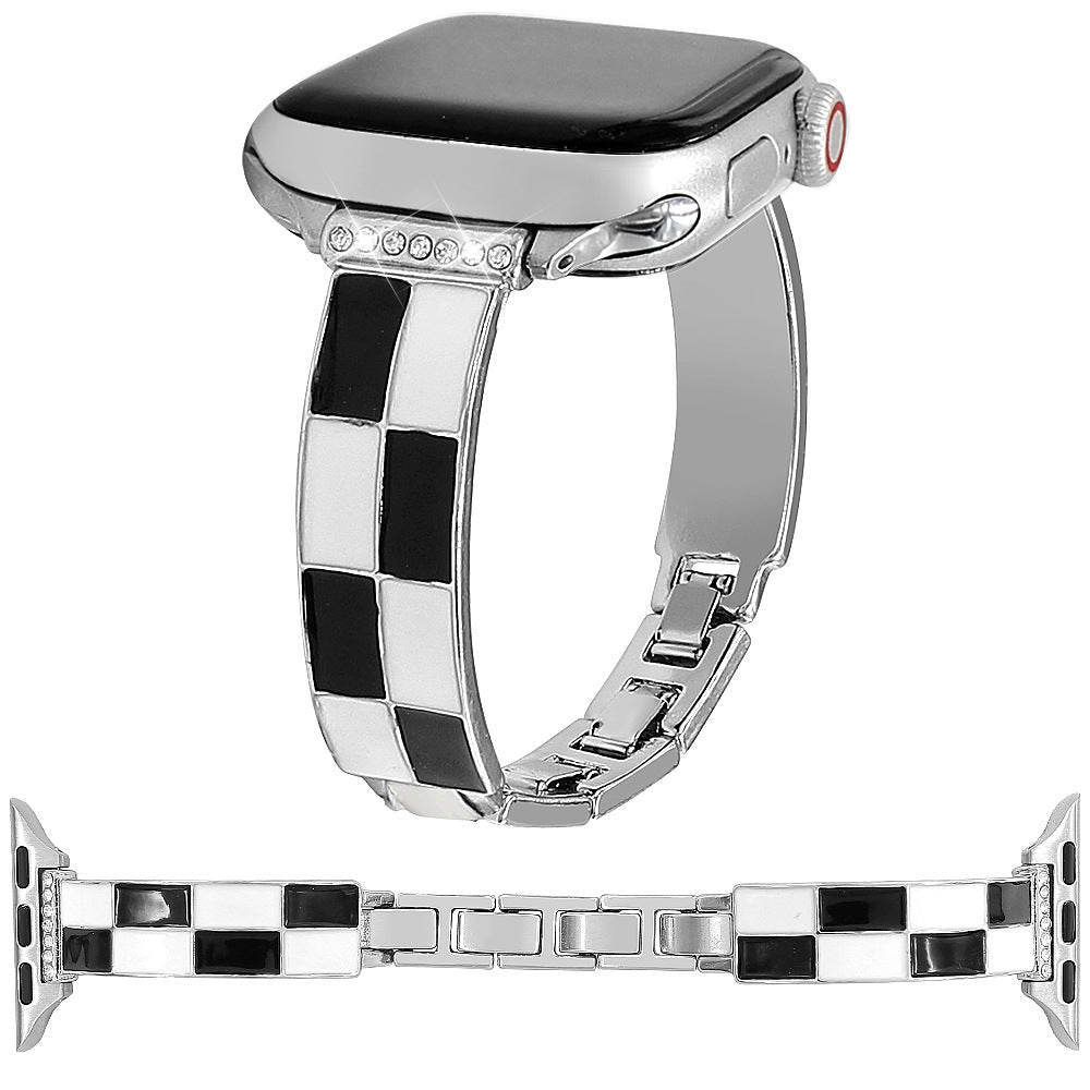 Black and white checkerboard band with silver-tone metal and Apple Watch